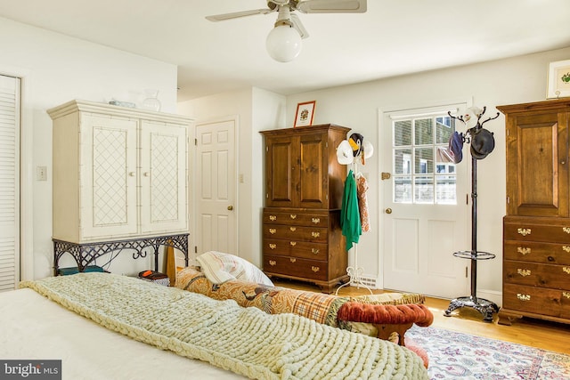 bedroom with ceiling fan and wood finished floors