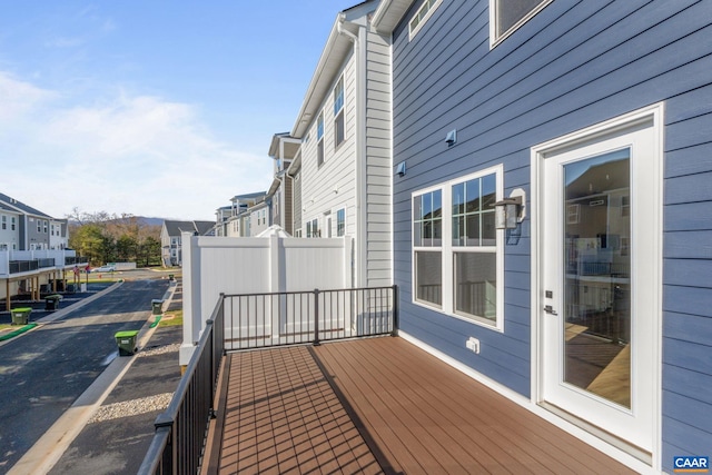 wooden terrace with a residential view