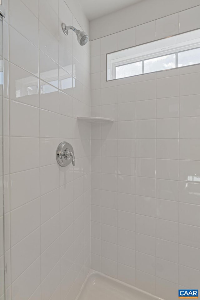 bathroom with a tile shower