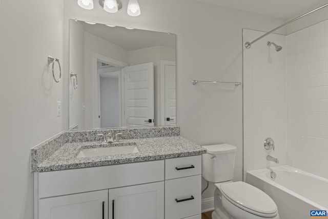 bathroom featuring shower / bathing tub combination, vanity, and toilet