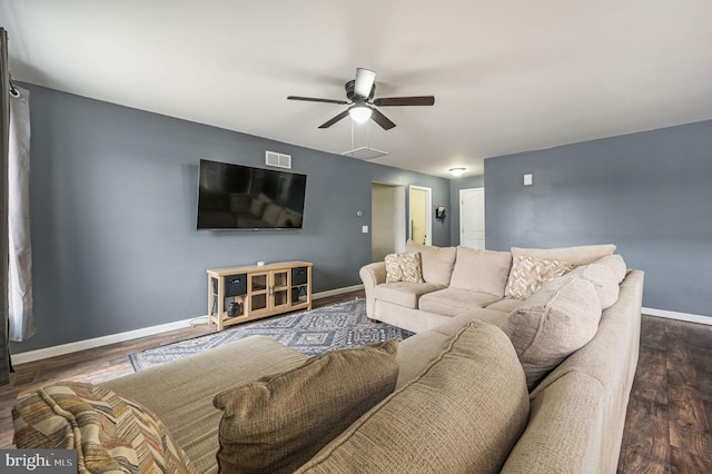 living area featuring a ceiling fan, visible vents, baseboards, and dark wood-style flooring