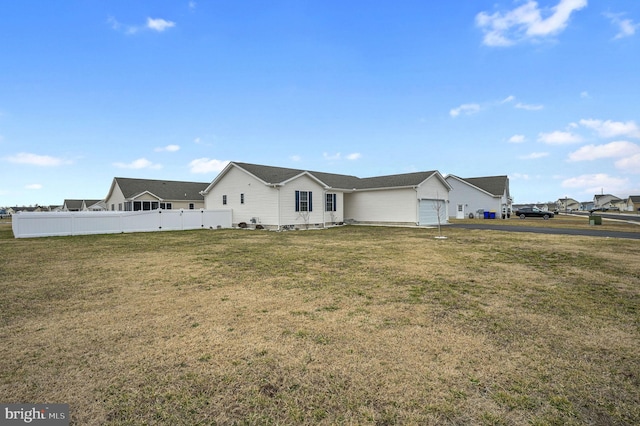 view of front of property with a front yard and fence