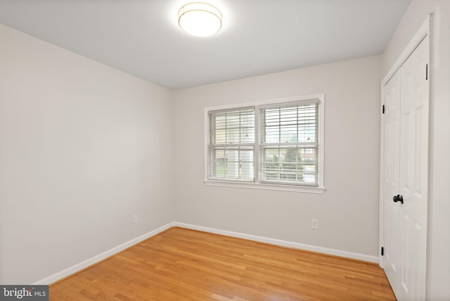 5924 Kimble Ct, Falls Church, VA 22041 - unfurnished bedroom featuring a closet, baseboards, and light wood-type flooring