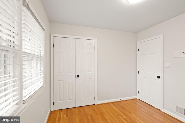 5924 Kimble Ct, Falls Church, VA 22041 - unfurnished bedroom featuring light wood-style floors, a closet, baseboards, and visible vents