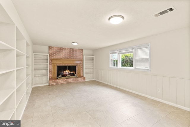 5924 Kimble Ct, Falls Church, VA 22041 - unfurnished living room featuring a fireplace, built in shelves, visible vents, and a wainscoted wall