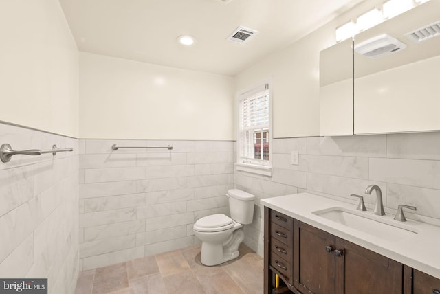 5924 Kimble Ct, Falls Church, VA 22041 - bathroom with toilet, visible vents, tile walls, and vanity