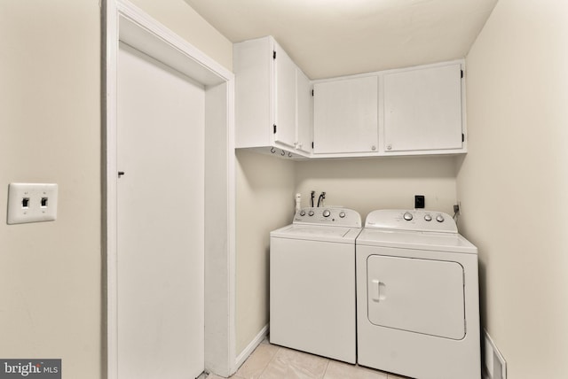 5924 Kimble Ct, Falls Church, VA 22041 - laundry area with light tile patterned floors, washing machine and dryer, and cabinet space