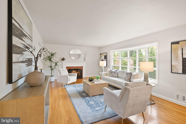 5924 Kimble Ct, Falls Church, VA 22041 - living room with a fireplace, visible vents, baseboards, and wood finished floors