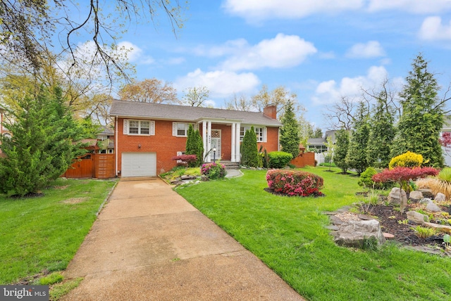 5924 Kimble Ct, Falls Church, VA 22041 - split foyer home with a front yard, fence, brick siding, a chimney, and driveway