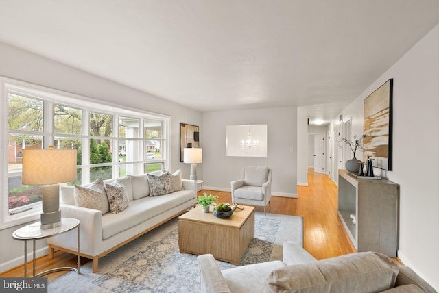 5924 Kimble Ct, Falls Church, VA 22041 - living room with baseboards, an inviting chandelier, and wood finished floors