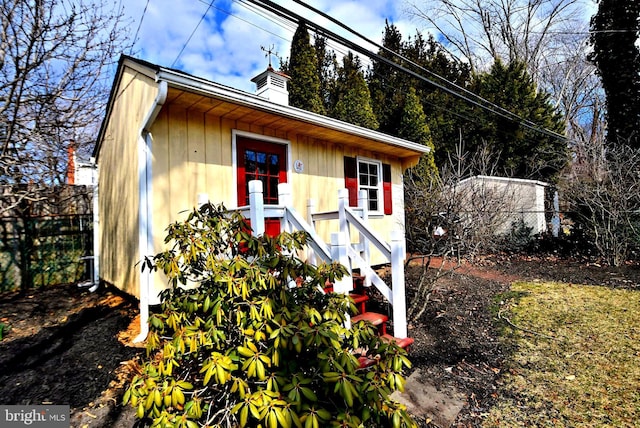 view of outdoor structure featuring fence