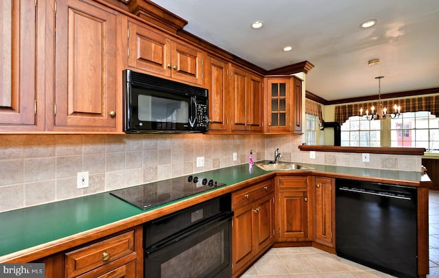 kitchen featuring light tile patterned floors, decorative backsplash, brown cabinets, black appliances, and a sink