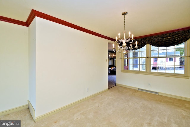 unfurnished dining area with baseboards, visible vents, ornamental molding, carpet floors, and a chandelier