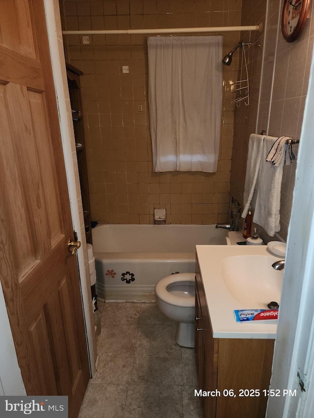 bathroom featuring tub / shower combination, vanity, and toilet