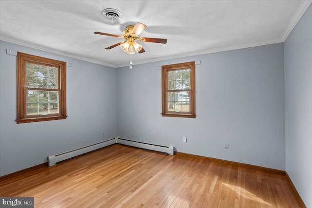 empty room with ornamental molding, a baseboard radiator, visible vents, and light wood-style flooring