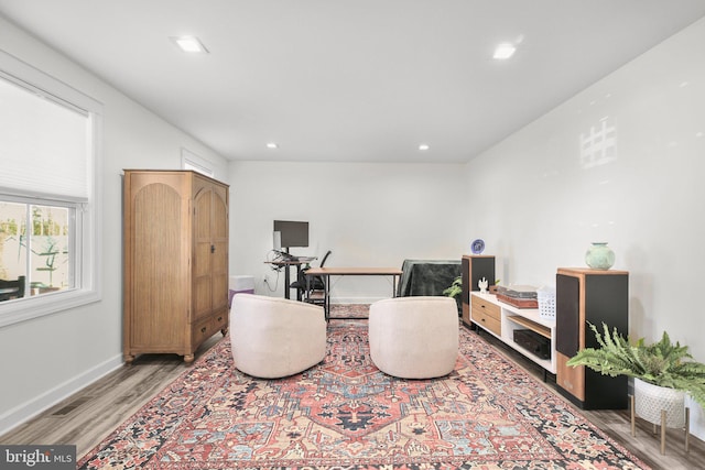 sitting room featuring recessed lighting, visible vents, light wood-style flooring, and baseboards