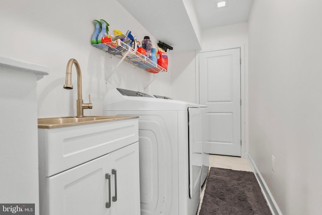 laundry room with laundry area, carpet, baseboards, and independent washer and dryer