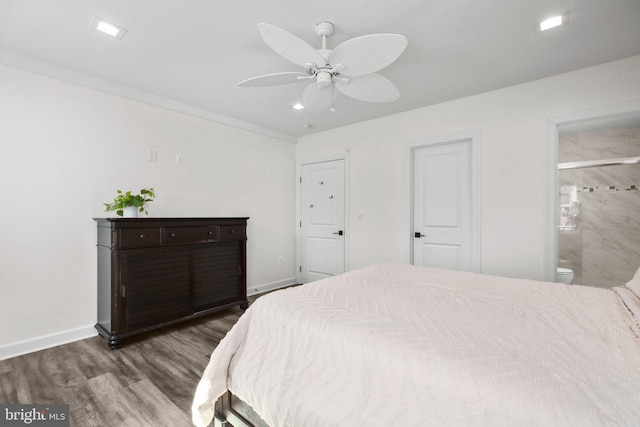 bedroom featuring recessed lighting, wood finished floors, a ceiling fan, baseboards, and ensuite bath