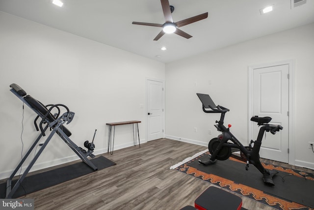 exercise room featuring recessed lighting, ceiling fan, baseboards, and wood finished floors