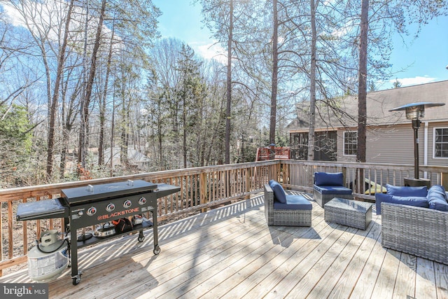 deck featuring grilling area and an outdoor hangout area