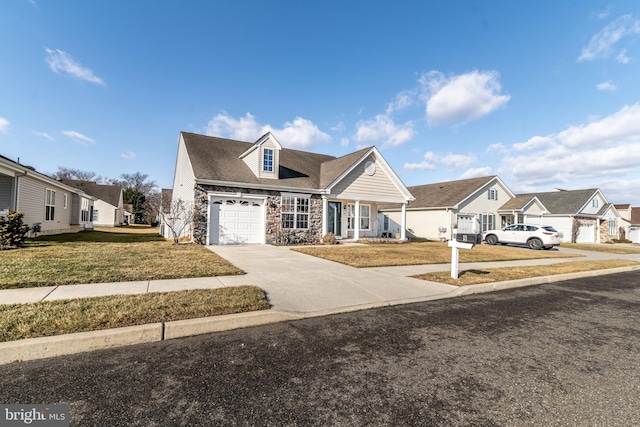 view of front of property featuring an attached garage, a residential view, stone siding, driveway, and a front lawn