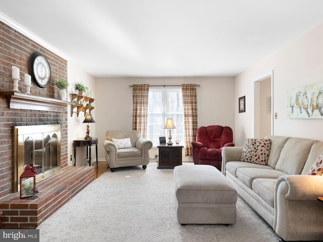 living room featuring carpet floors and a brick fireplace