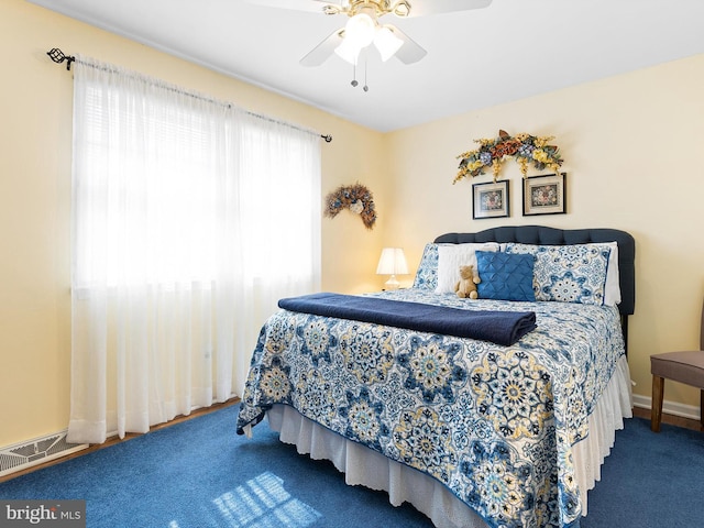 bedroom featuring ceiling fan, carpet flooring, visible vents, and baseboards