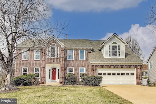 view of front of home with brick siding, roof with shingles, concrete driveway, a garage, and a front lawn