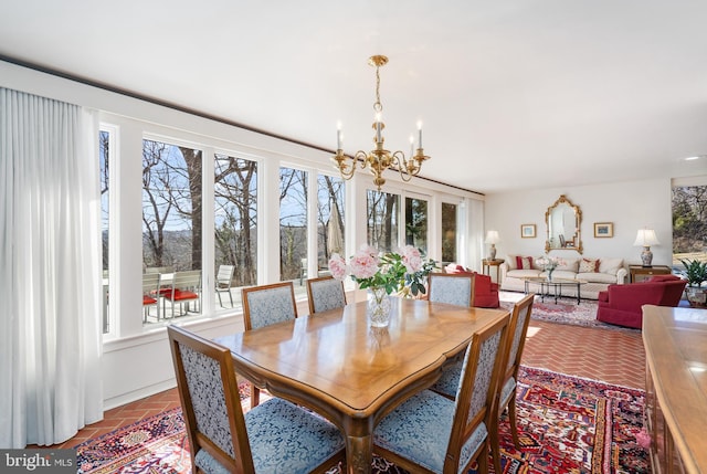 dining area featuring brick floor and a healthy amount of sunlight