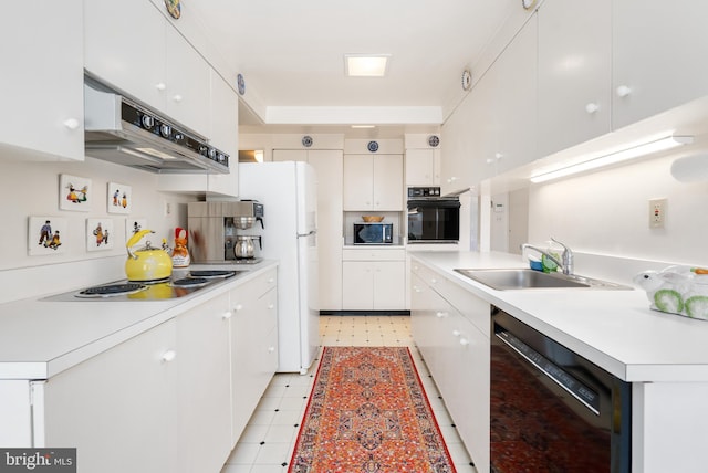 kitchen featuring black appliances, a sink, white cabinets, and under cabinet range hood