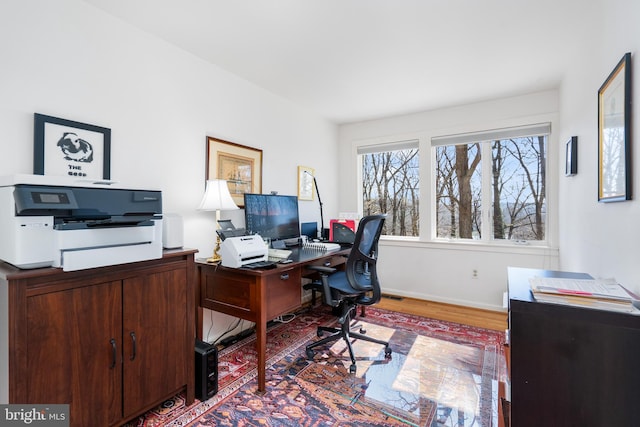 office featuring wood finished floors and baseboards