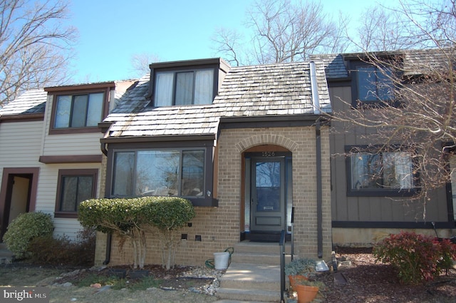 view of front of house featuring brick siding