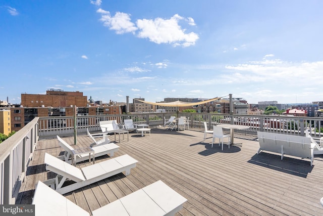 wooden terrace featuring a city view