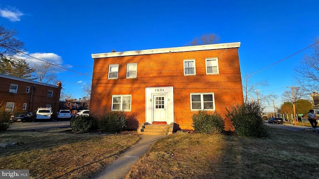 colonial house with brick siding