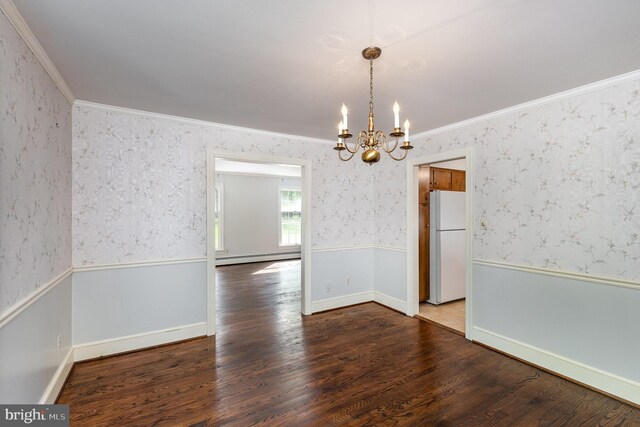 13086 Langley Rd, Bryantown, MD 20617 - unfurnished dining area featuring an inviting chandelier, crown molding, wood finished floors, baseboard heating, and wallpapered walls