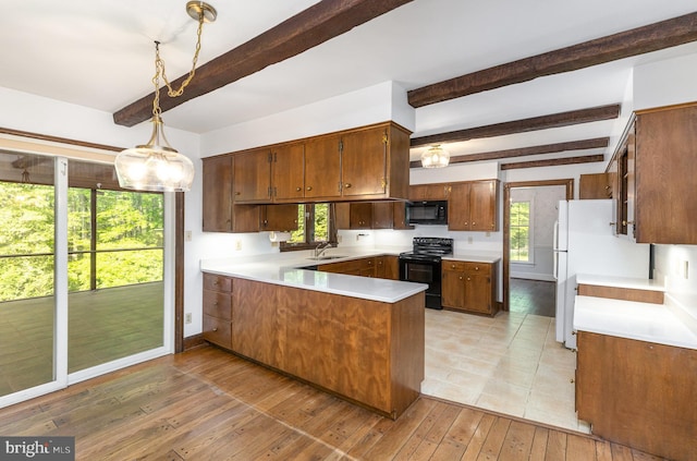 13086 Langley Rd, Bryantown, MD 20617 - kitchen featuring a sink, a peninsula, light wood-type flooring, beamed ceiling, and black appliances