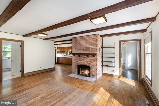 13086 Langley Rd, Bryantown, MD 20617 - unfurnished living room featuring wood-type flooring, beamed ceiling, a baseboard heating unit, and a baseboard radiator