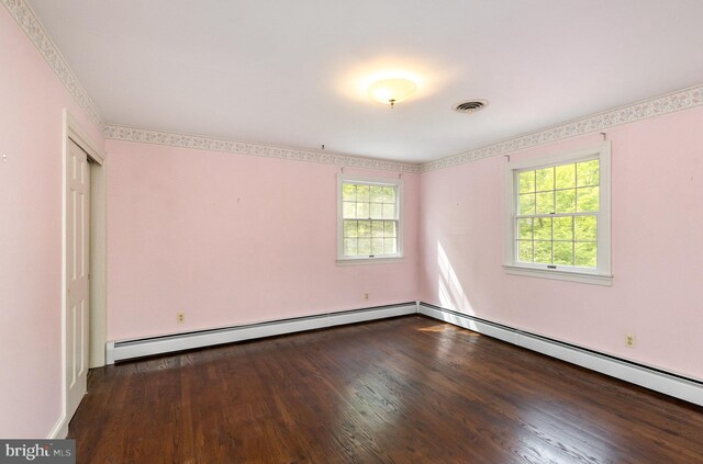 13086 Langley Rd, Bryantown, MD 20617 - unfurnished bedroom featuring multiple windows, wood finished floors, and visible vents
