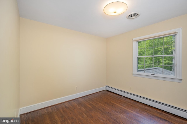 13086 Langley Rd, Bryantown, MD 20617 - empty room featuring baseboards, dark wood finished floors, baseboard heating, and visible vents