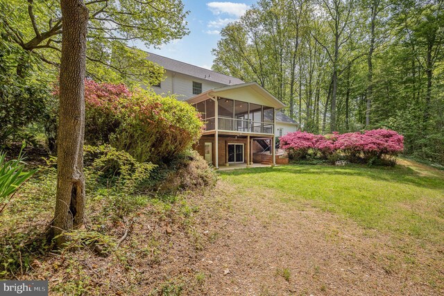 13086 Langley Rd, Bryantown, MD 20617 - rear view of property with a sunroom and a yard