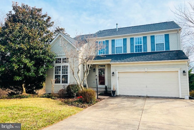 traditional-style house featuring a front lawn, an attached garage, driveway, and a shingled roof