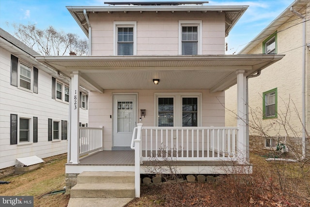 property entrance with covered porch