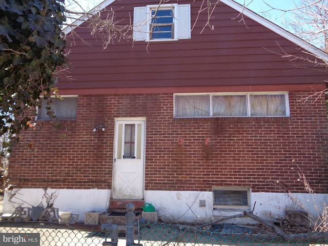 exterior space with brick siding