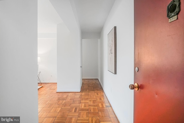 corridor featuring baseboards