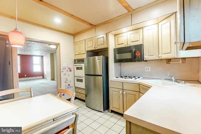 kitchen featuring pendant lighting, light countertops, a baseboard heating unit, a sink, and white appliances