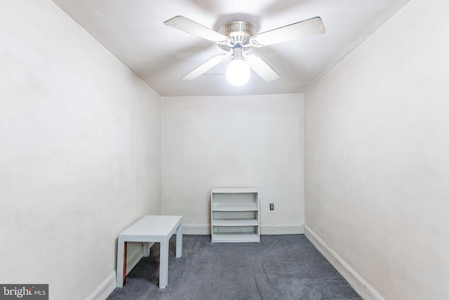 interior space featuring carpet, baseboards, and a ceiling fan