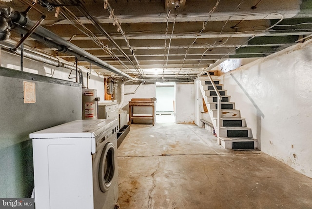 unfinished basement with water heater, washer / dryer, and stairs