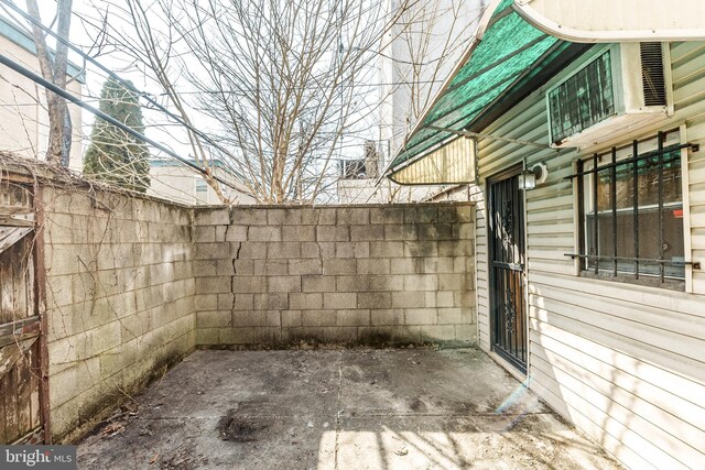 view of patio featuring fence