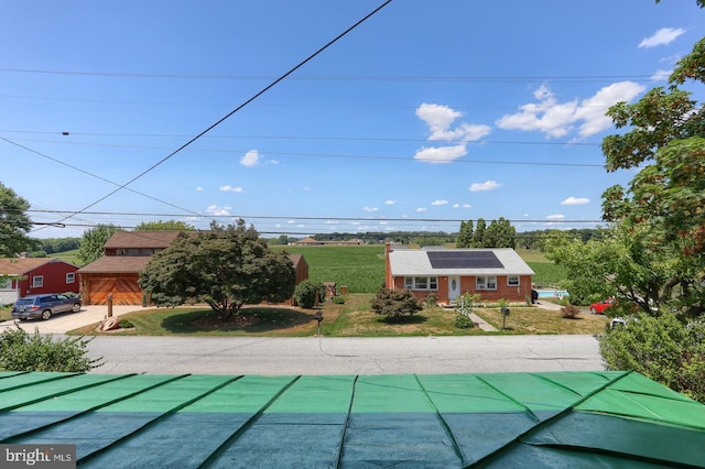 view of pool featuring a lawn