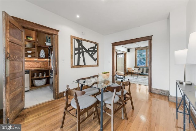 dining area with light wood-type flooring